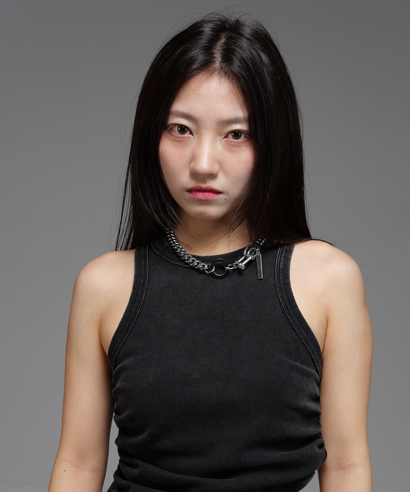 Model wearing a Human Unbalance Center chain