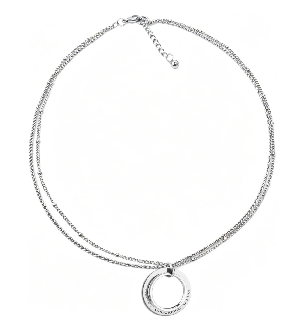 Silver-tone layered double-strand necklace with an engraved open ring pendant on a white background.