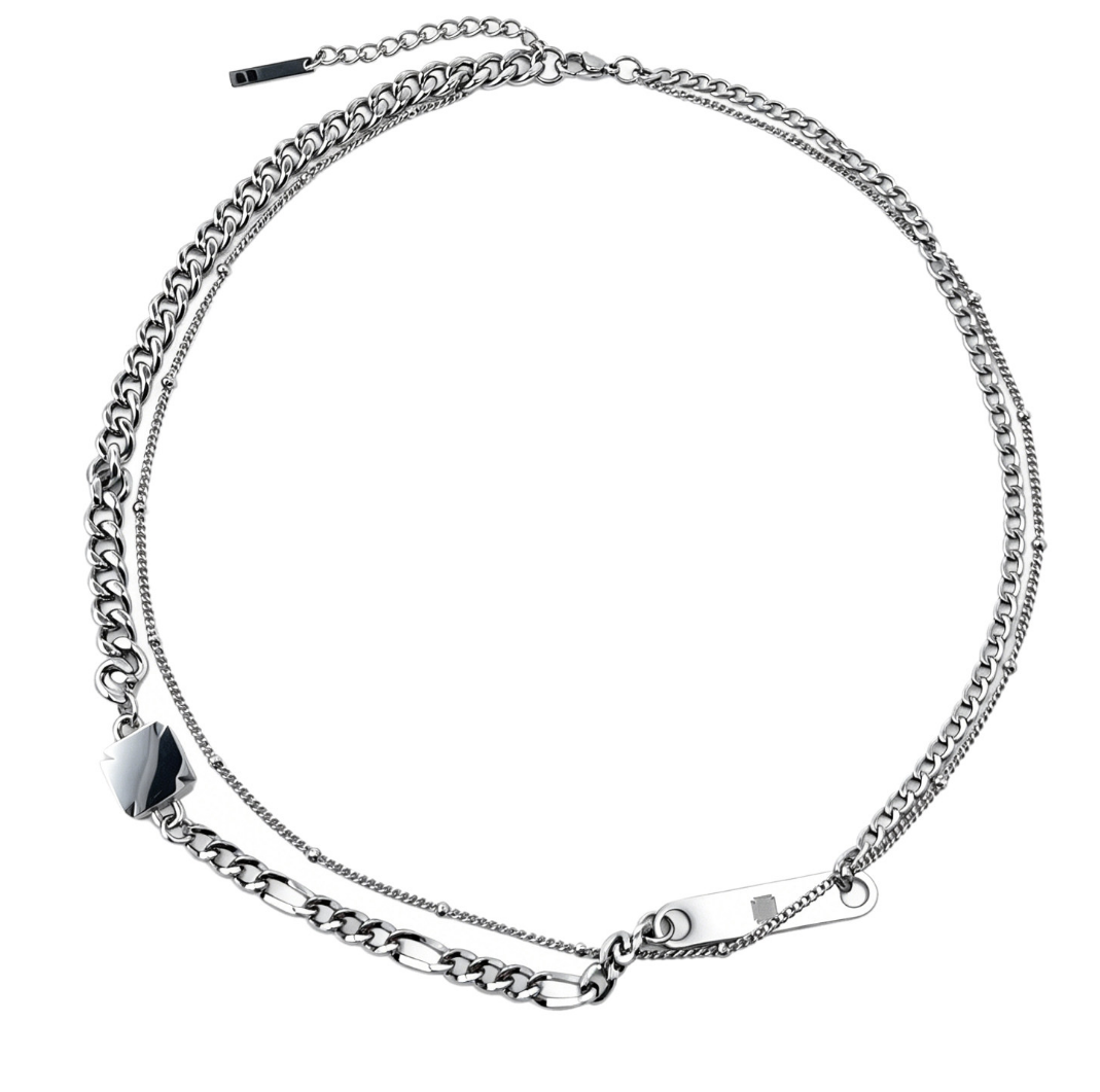 Silver-tone layered double-chain necklace with a black-enamel plaque and engraved ID bar.