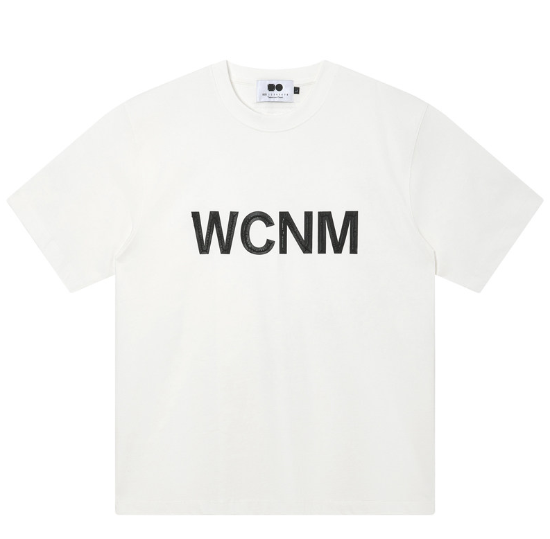 White heavyweight cotton tee with large black WCNM lettering printed across the chest.