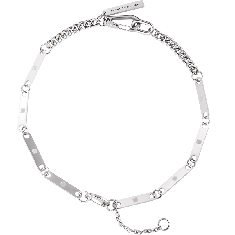 Silver-tone necklace of studded flat bar links joined by rings, with curb chain and an oversized clip clasp, on a white background.