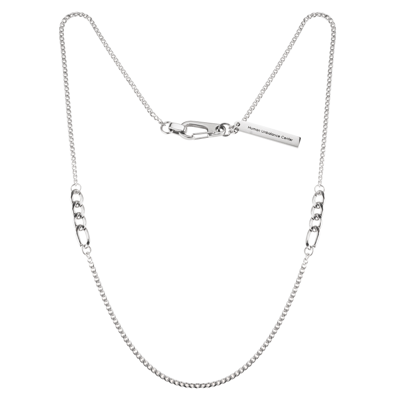 Silver-tone chain necklace with oversized oval link stations and an engraved bar clasp on a white background.