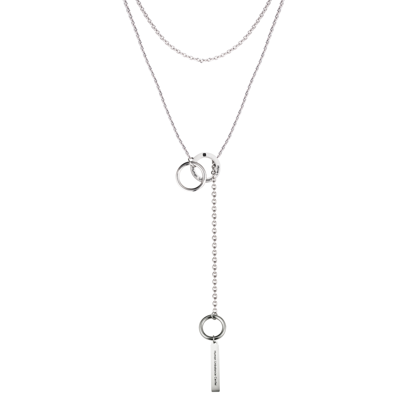 Silver-tone layered lariat necklace with interlocking engraved rings and a suspended engraved bar on a Y-drop chain.
