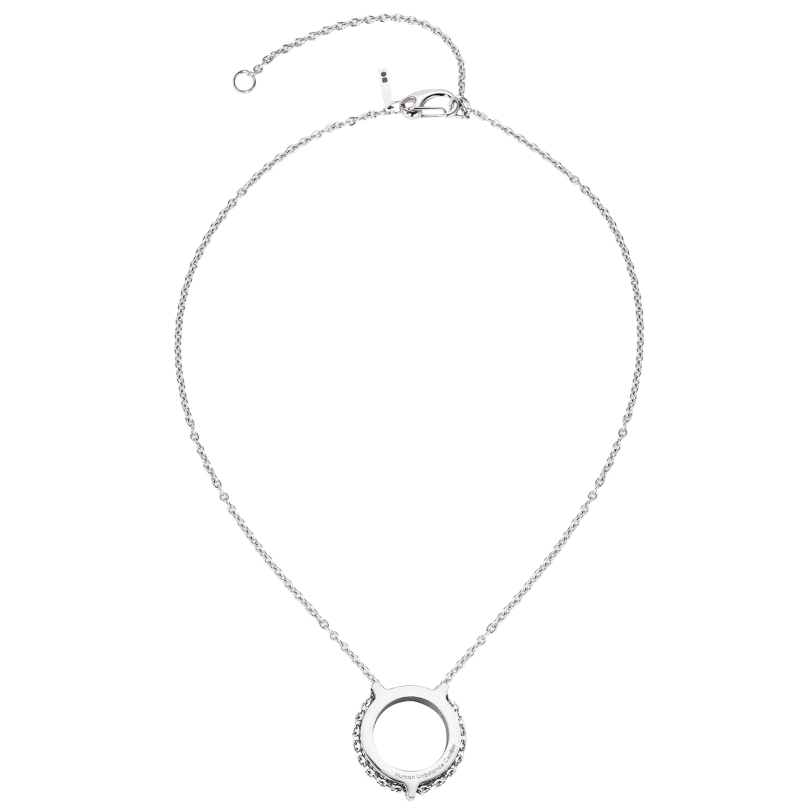 Silver-tone necklace on a fine chain with an open engraved ring pendant.