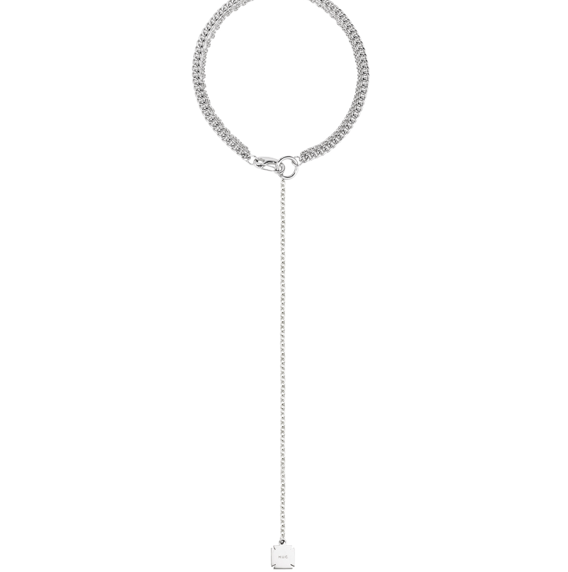 Silver-tone lariat necklace with a doubled curb-chain collar dropping into a fine cable chain and engraved square tag.