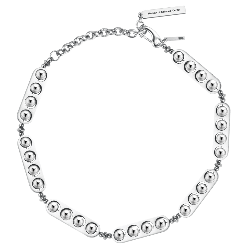 Silver-tone necklace of angular studded plates linked by textured chain